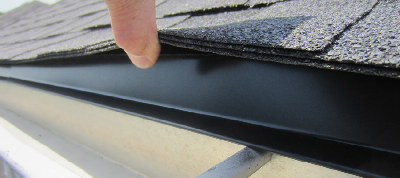 Close up image of black drip edge installed on a roof