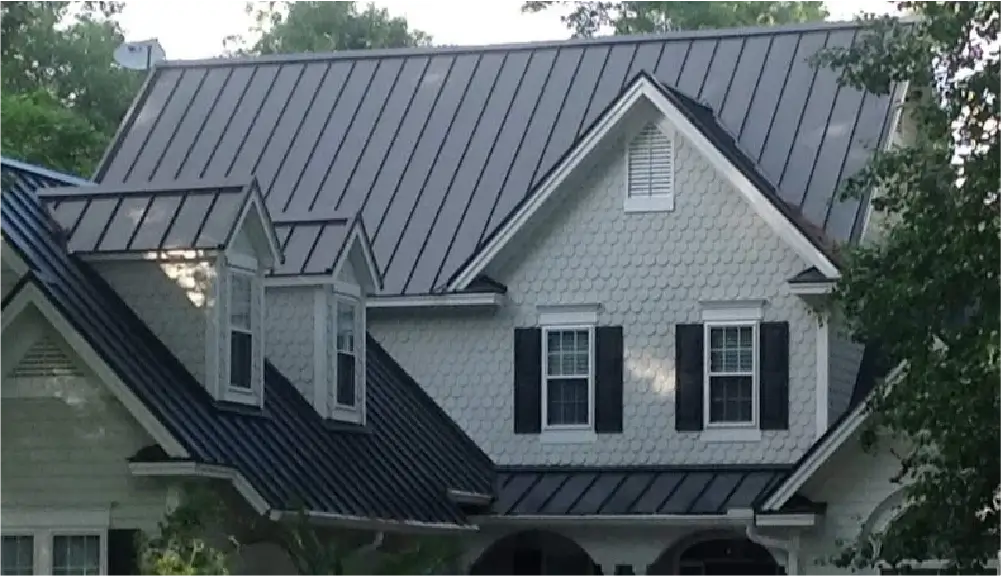 House with standing seam metal roofing