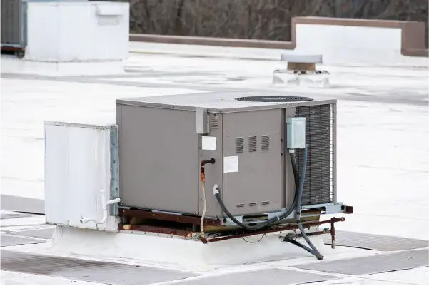 Image of air conditioning unit mounted to a commercial roof