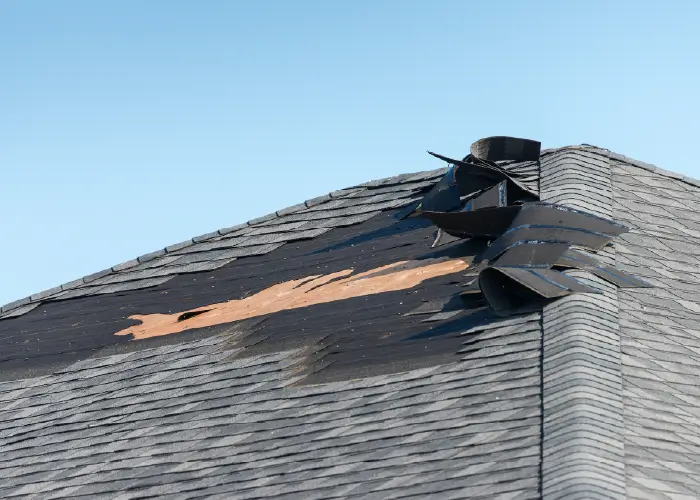 Image of a roof that has had shingles blown off due to wind damage