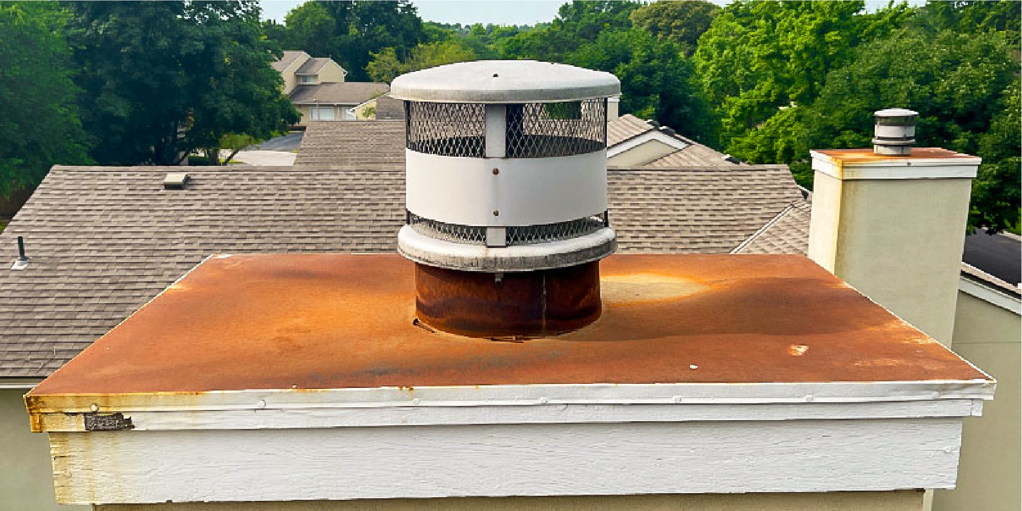Image of a rusted out chimney cap causing chimney leaks