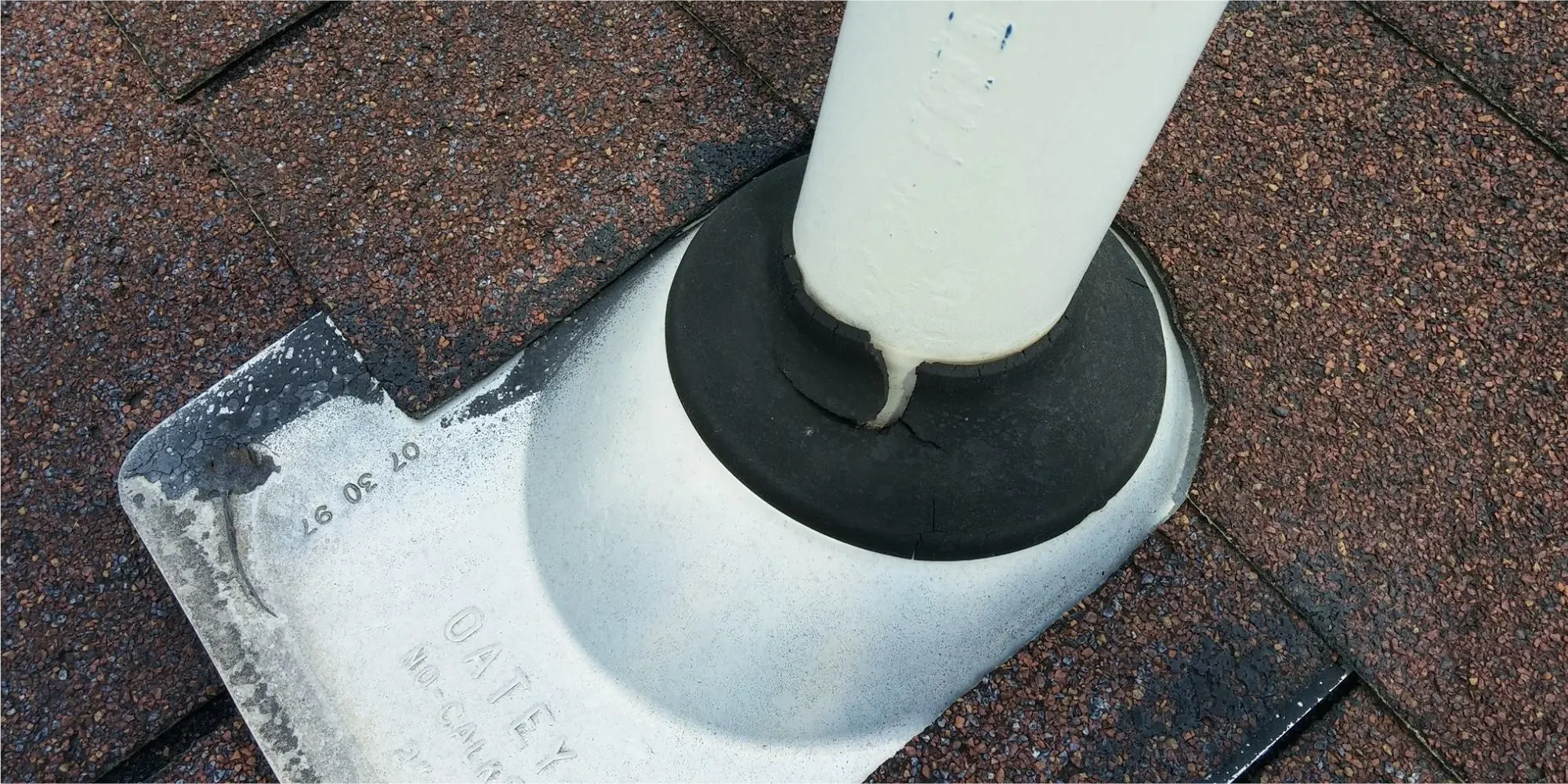 Image of a rubber pipe flashing on a roof that has cracked causing a roof leak