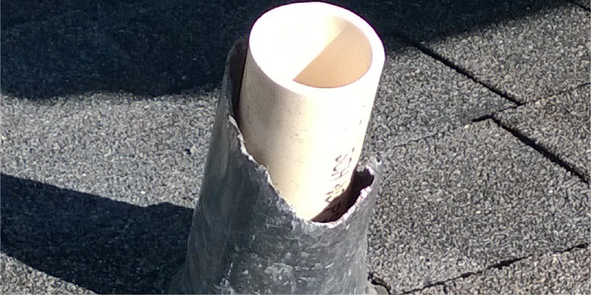 Photo of a pipe flashing on a roof that has been chewed by squirrels